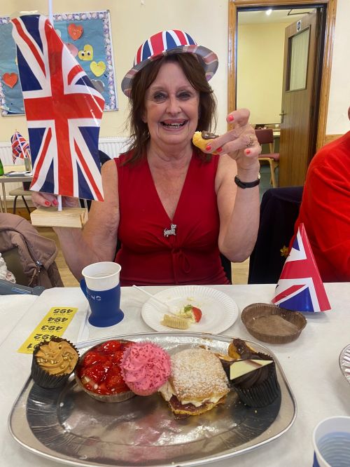Paula with flag & cake